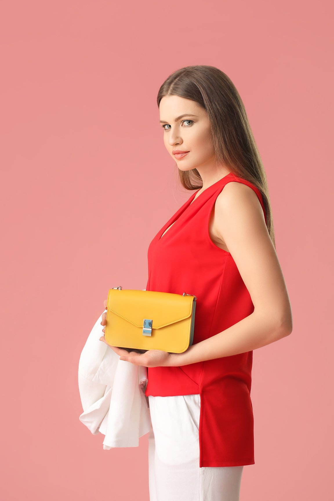 Beautiful Woman with Stylish Bag on Color Background